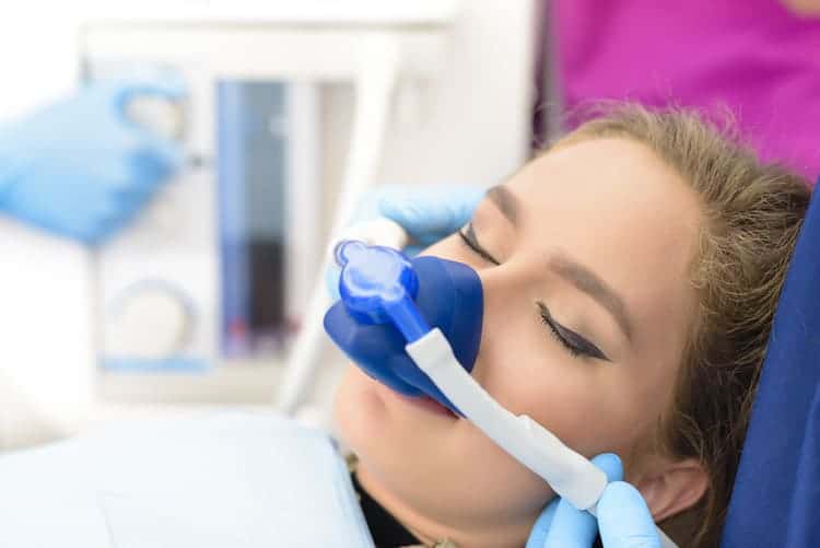 A woman being sedated at a dental clinic