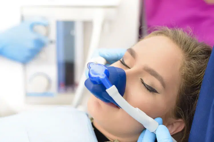 Female patient receiving sedation dentistry at a dental clinic in Tampa, FL